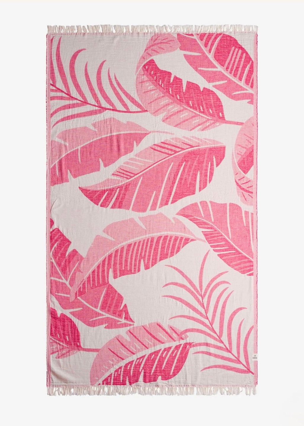 Towel with pink leaf pattern on a white background